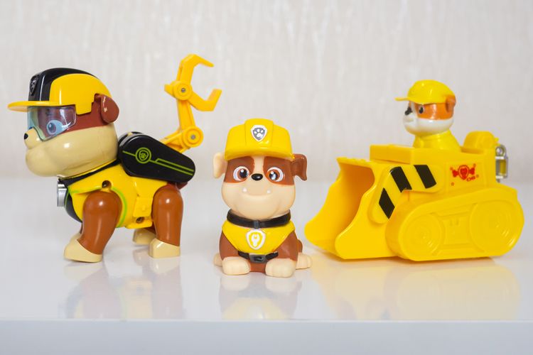 Rubble Paw Patrol english Bulldog Toy, gesture, yellow, cartoon, font, gas, bath toy, baby toy, art, figure,
